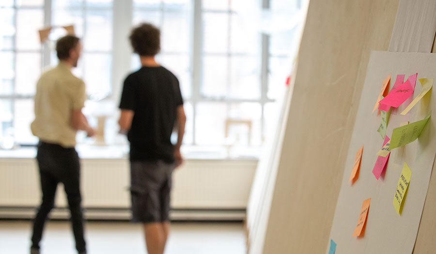 Two architects by a window