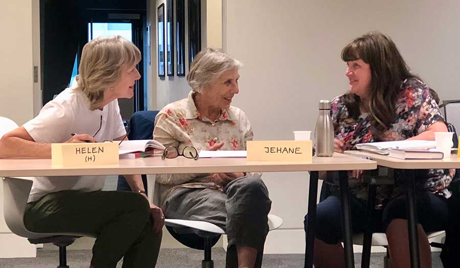 Three female students in discussion