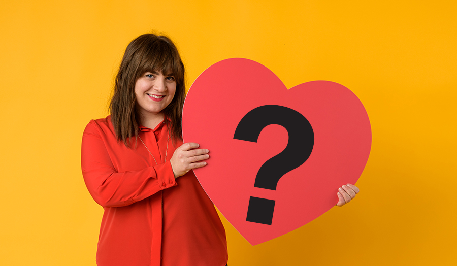 Student holding a love heart