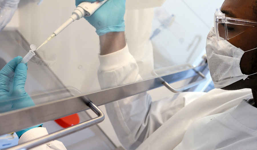 Student pipetting sample in Science Centre
