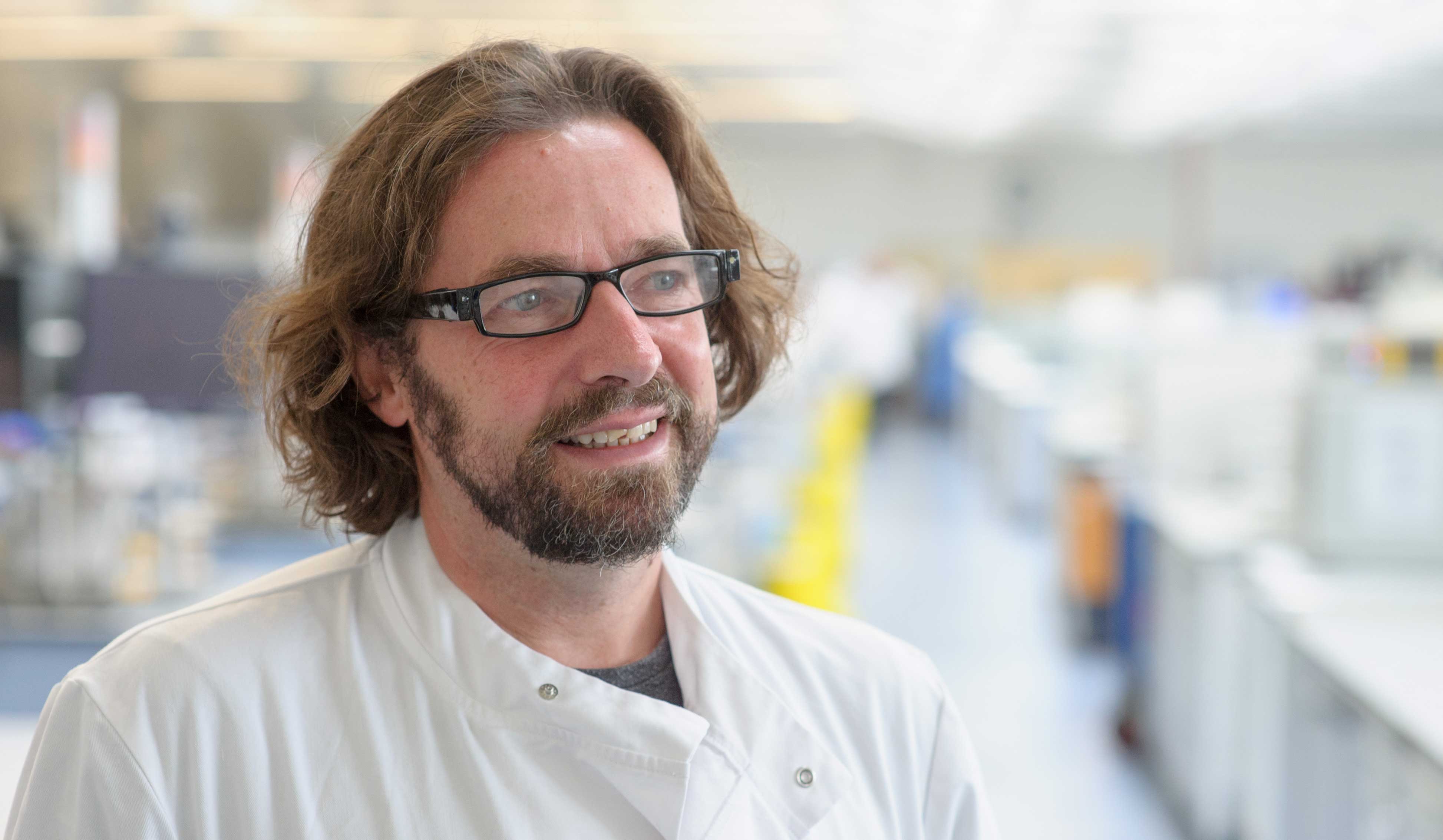 Male member of staff in the science lab