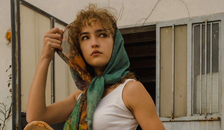 India Gustin in a headscarf