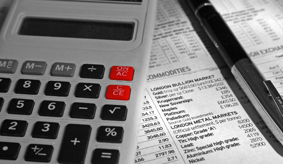 Calculator, stocks and pen