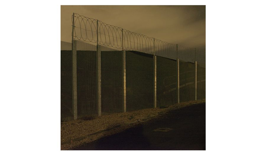 Night view of a fence in Nunhead