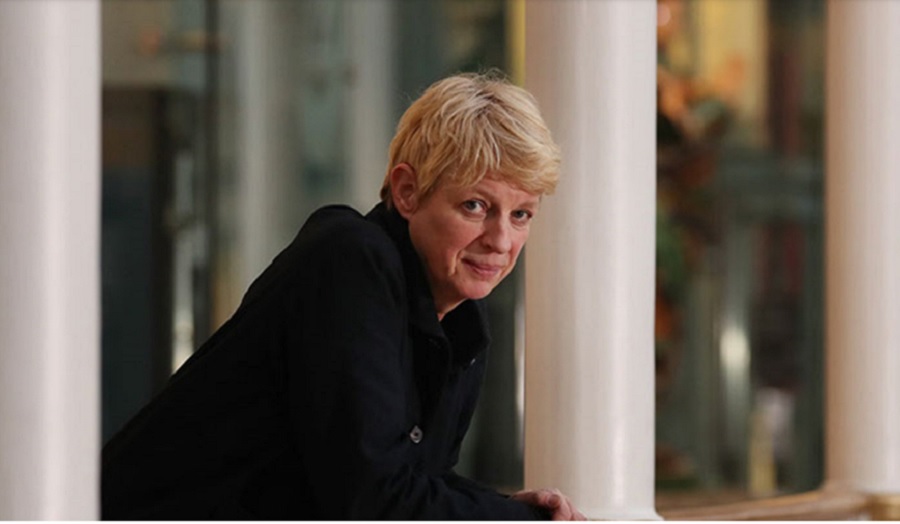 portrait of woman leaning over balcony