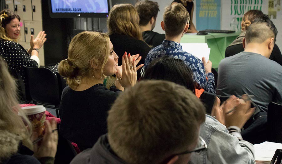 Audience applauding at the end of a talk
