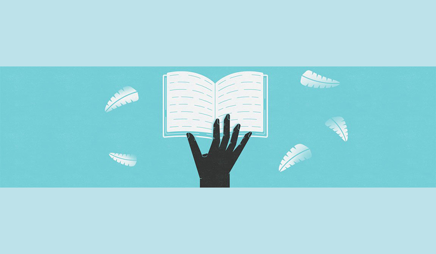 A black silhouette of a hand on top of an open book