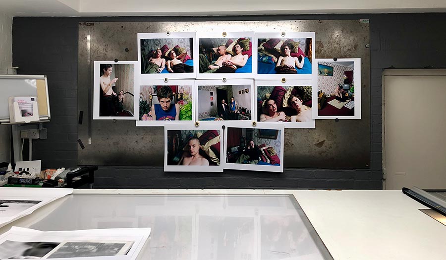 A series of selected photographs that are fixed on the wall of Marc's studio