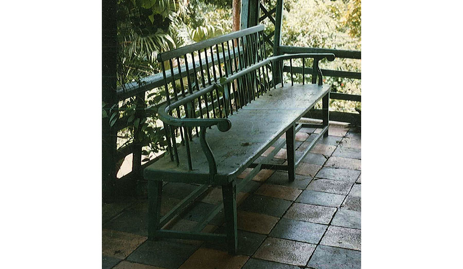 An eighteenth century Windsor bench from the 1770s, on a piazza in Jamaica.  
