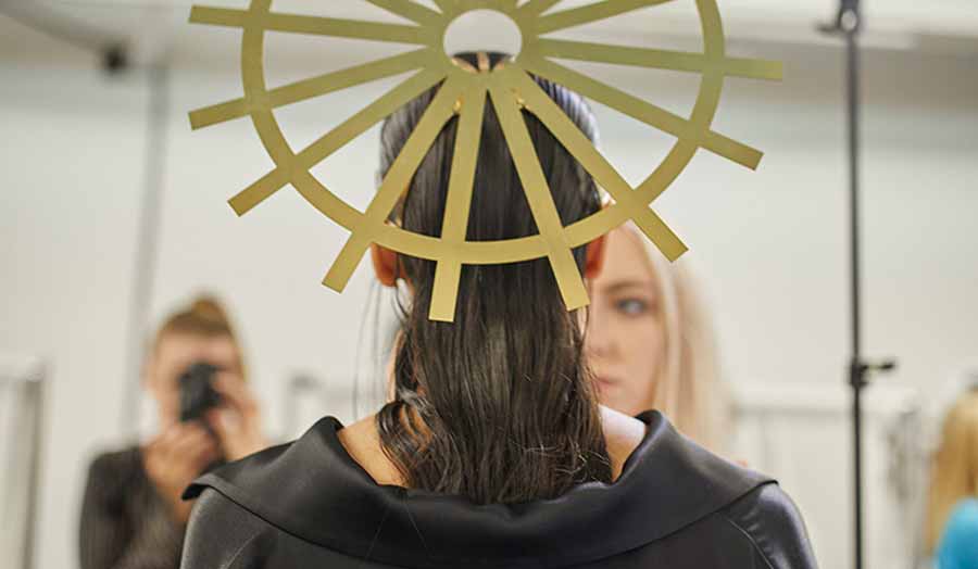 The ponytail on the back of the woman's head 