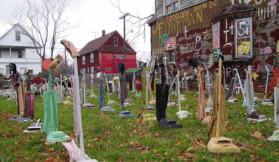 Old electric hovers aligned in a garden