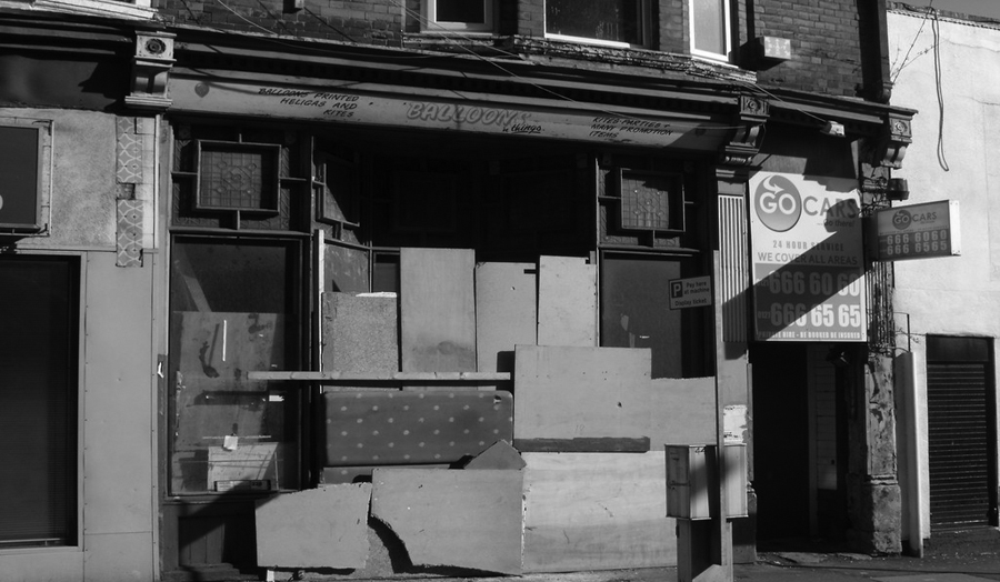 Boarded up shop on Essex Road
