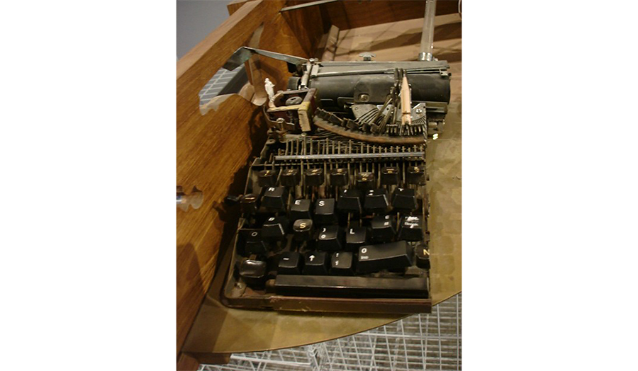 A half of a typewriter that has been cut in halves