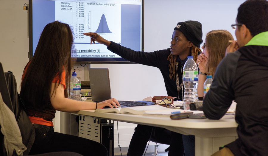 Students discussing a mathematics problem