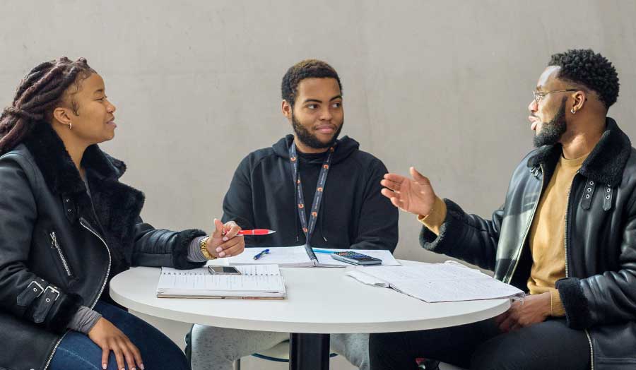 Three London Met students in the grad centre