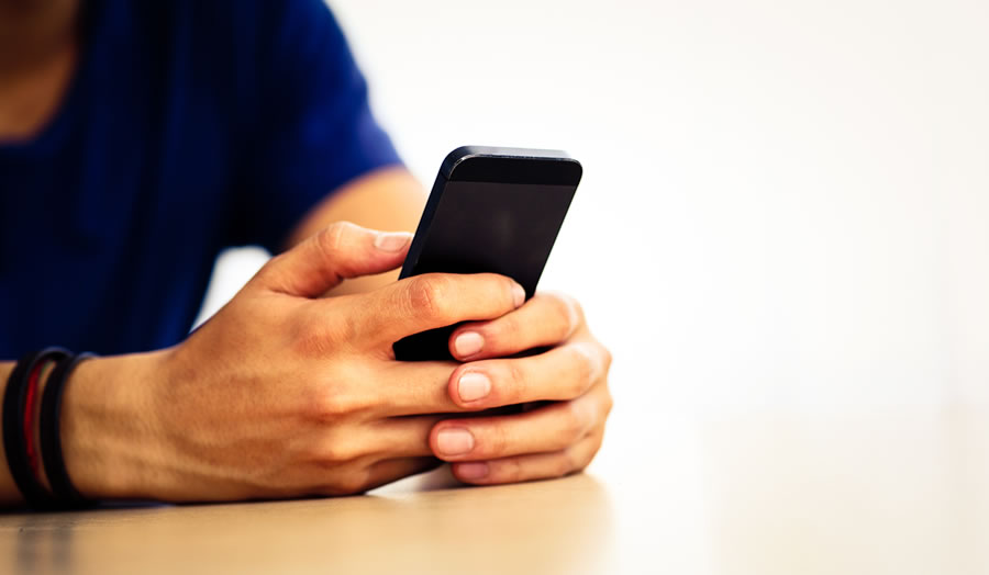 A person holding a mobile phone