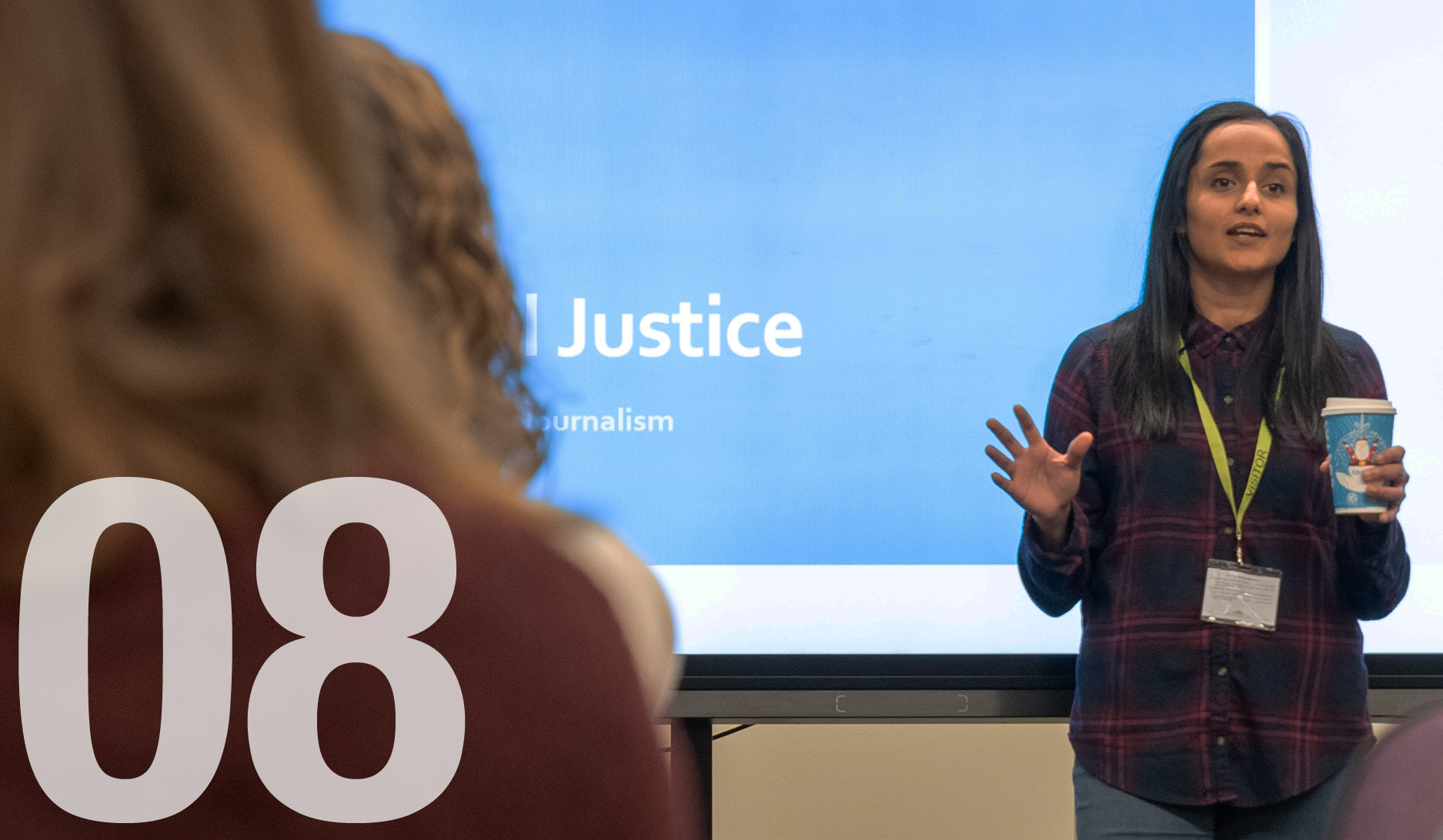 The word Justice on screen at London Met journalism talk with 08 superimposed for August