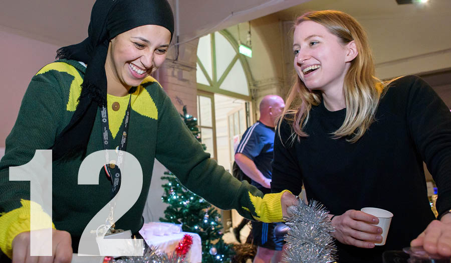 Students with 12 superimposed at Christmas event