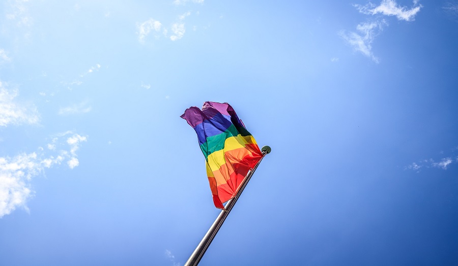 Flag blowing in wind, sky background