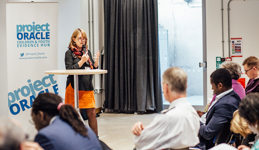 Professor Georgie Parry-Crooke delivering at a Project Oracle conference