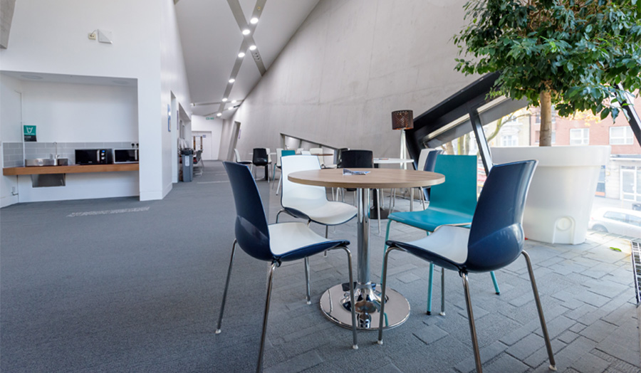 Graduate Centre foyer by window with table and chairs