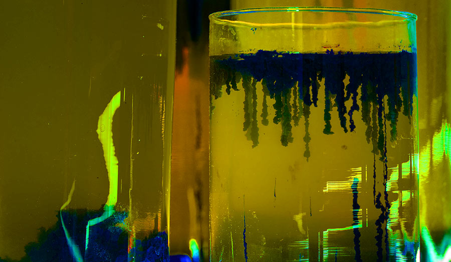 Green fluid in a glass tube