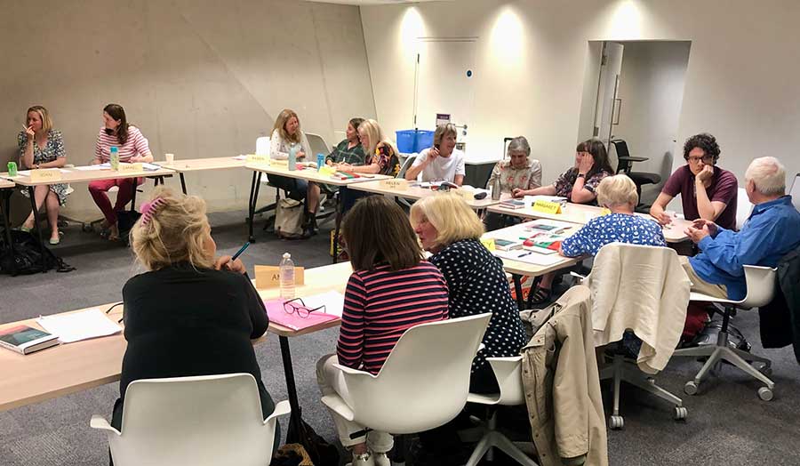 A group of students in the class in discussion