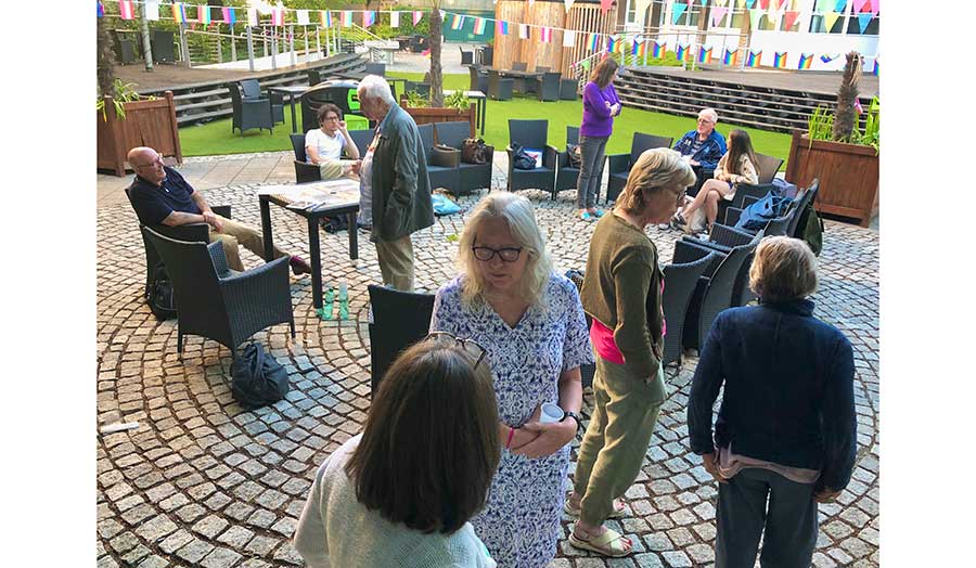 Students on the inner courtyard walking and discussing