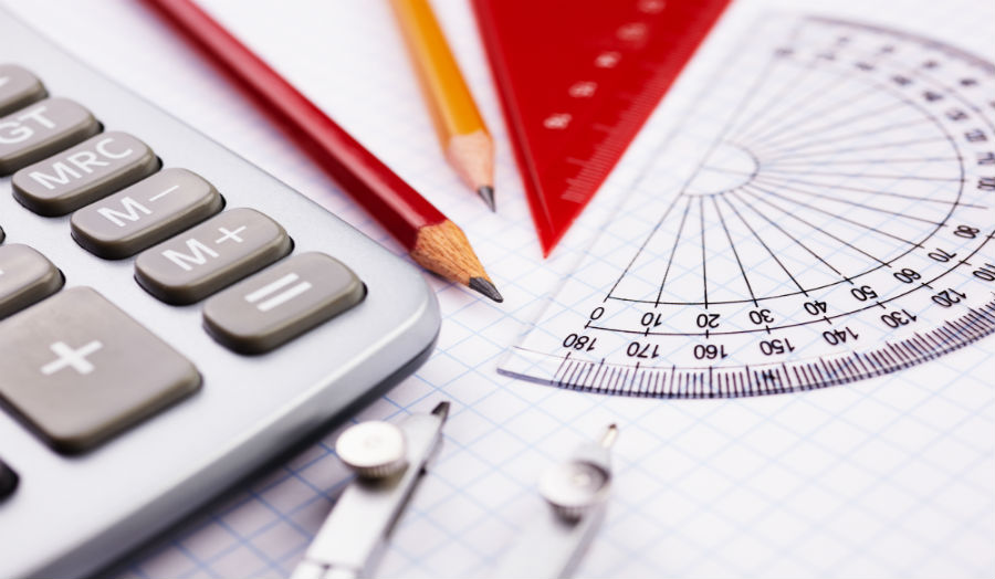 Picture of calculator, pencil and geometry measures.