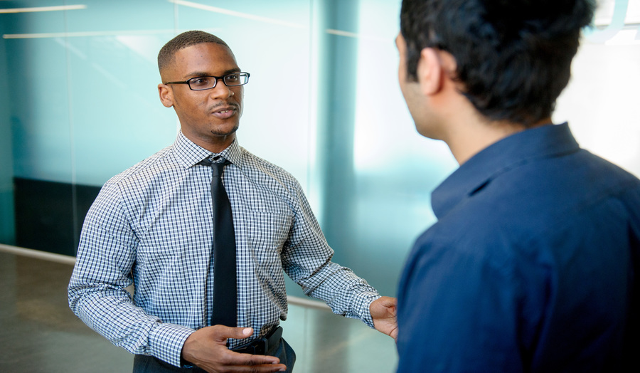Two postgraduate male students interacting