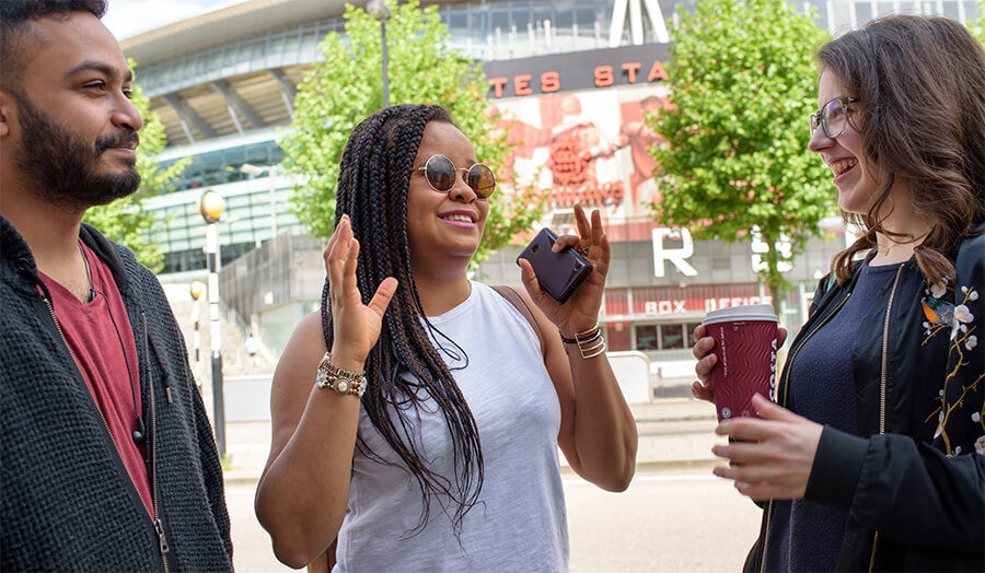 Students socialising by the Emirates Stadium