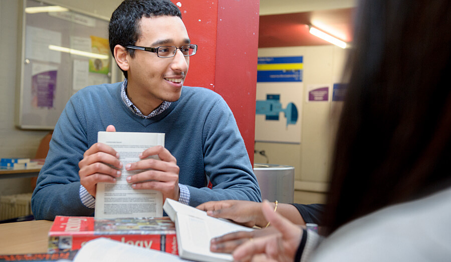 Male student studying in a group