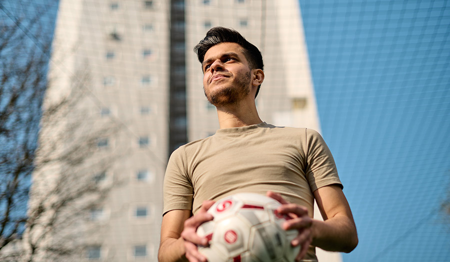 Aaron Patel holding football