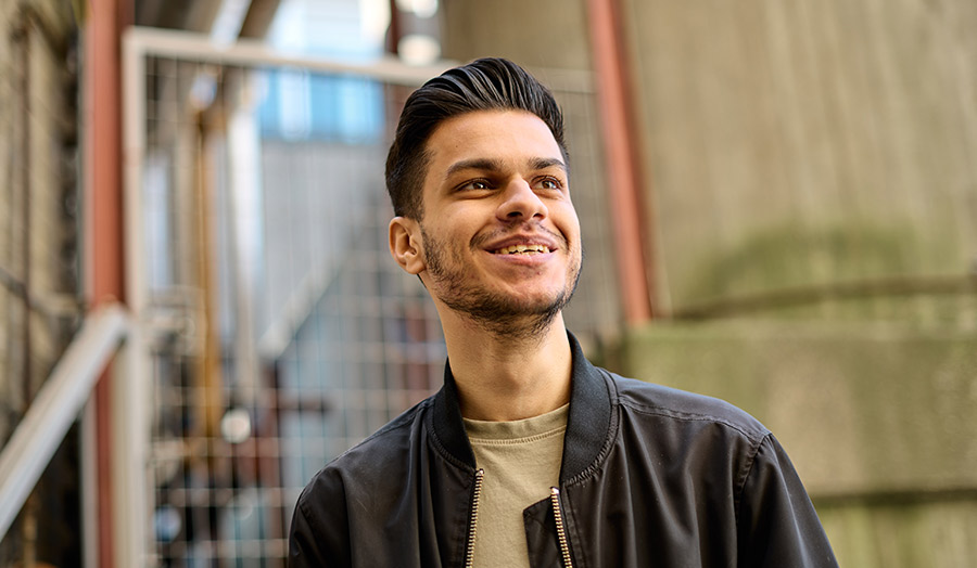 Aaron Patel on campus, smiling