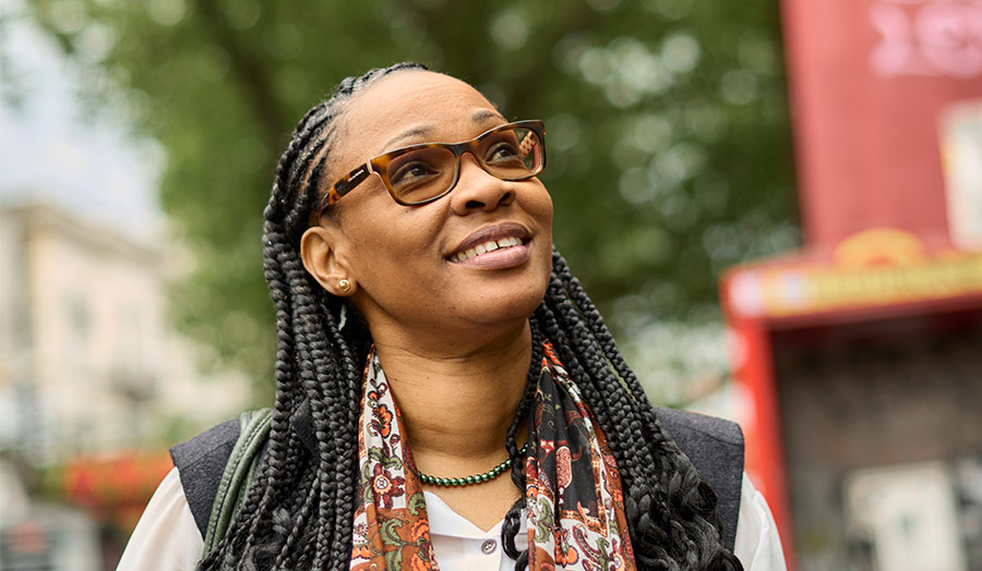 Denise smiling and looking upwards
