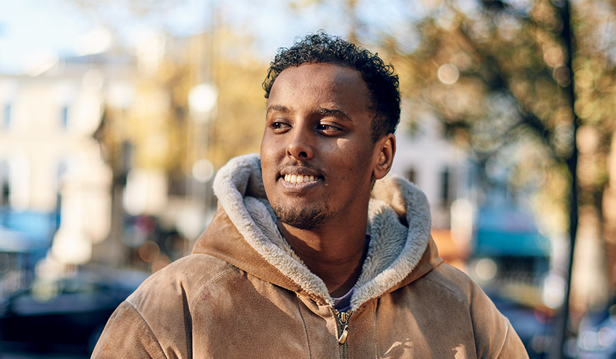 Diini smiling with leafy background