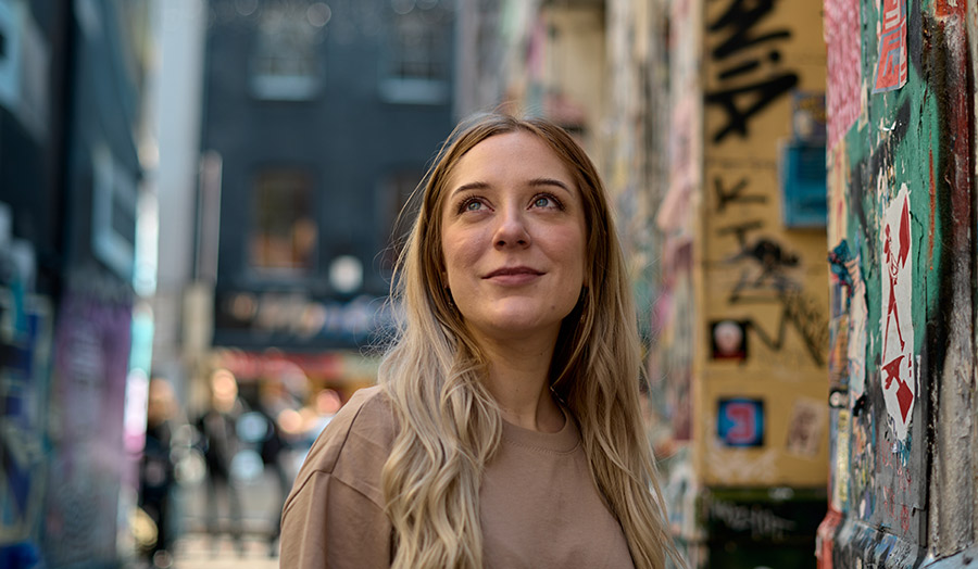 Hailey with graffiti background in London