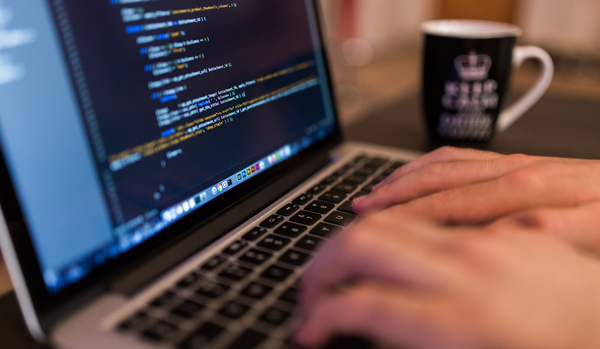 hands typing on a laptop